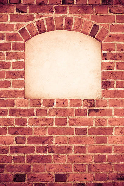 istock Old arch arc with copy space in brick wall 504912262
