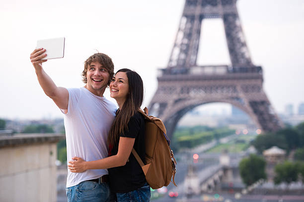 istock Couple taking selfie at the Eiffel Tower in Paris 504912304