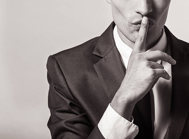 shhh! - finger on lips whispering secrecy silence imagens e fotografias de stock