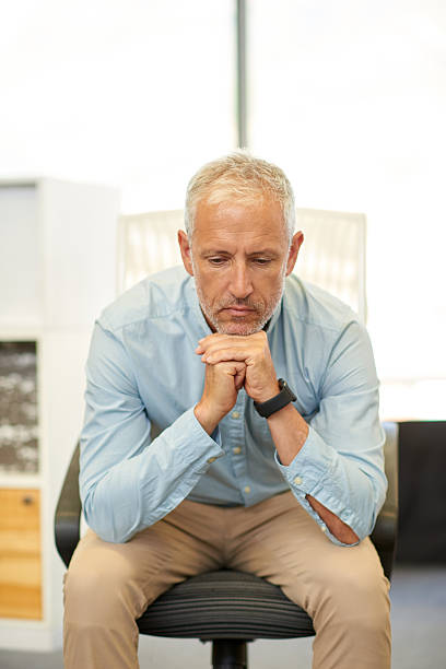 istock Businessman looking tired in real office location 504916982