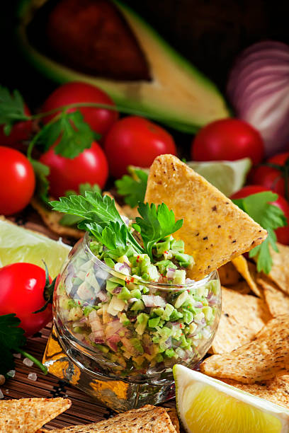 istock Mexican fast food, corn nachos with guacamole sauce 504919332