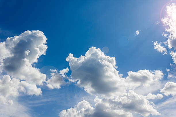 istock Beautiful light blue sky with puffy white clouds 504919412