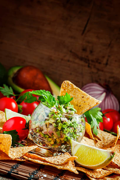 istock Mexican fast food, corn nachos with guacamole sauce 504919464