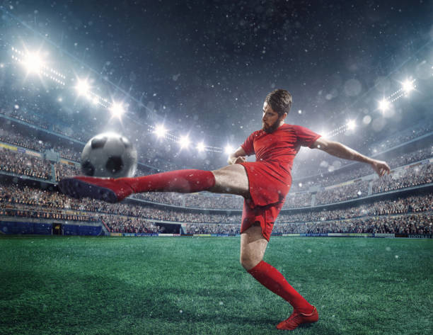 istock Soccer player kicking a ball 504922472