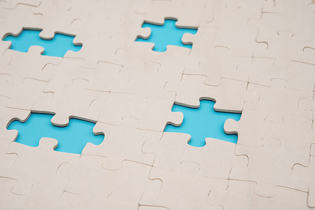 istock jigsaw puzzle with 4 pieces missed on blue background 504923062
