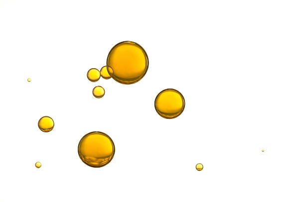 Olive oil Yellow air bubbles isolated over a white background essential oil stock pictures, royalty-free photos & images