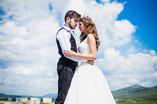 istock the groom with the bride on the rooftop 504924112
