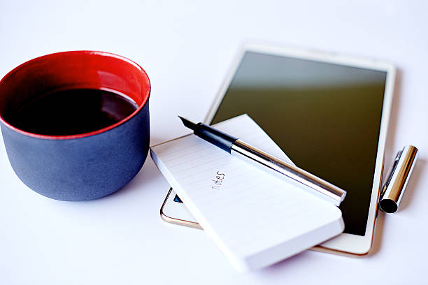 High angle shot of a coffee, a tablet and a notepad on a deskhttp://195.154.178.81/DATA/i_collage/pu/shoots/806213.jpg