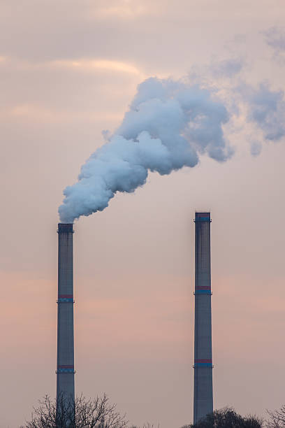 istock Industrial scenery with smoke from coal powered plant 504925516
