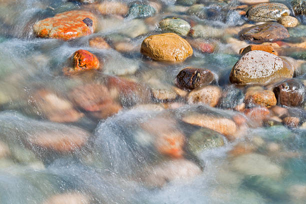 istock Pebble stones in the river water close up view, 504926786