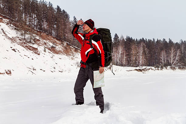 istock hiker with a map of location 504927062