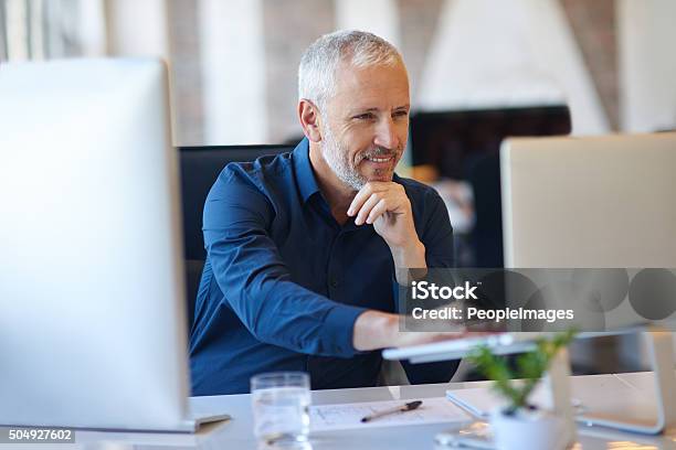 Making Use Of Online Resources Stock Photo - Download Image Now - Men, Computer, Laptop