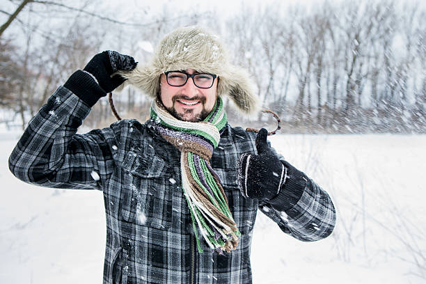istock man in a fur hat. thumbs up 504929152
