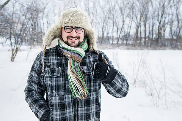 istock man in a fur hat. thumbs up 504929214