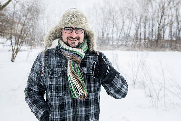 istock man in a fur hat. thumbs up 504929284