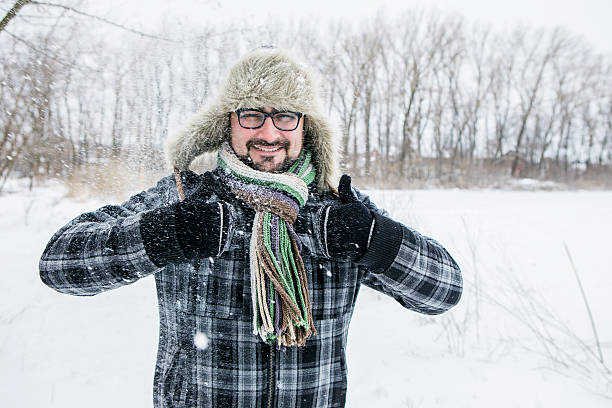 istock man in a fur hat. thumbs up 504929644
