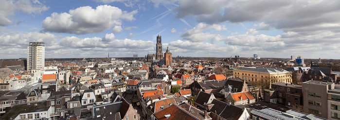 Scenic digital composite panorama of the city center of Utrecht, The Netherlands, with the 13th century Dom Cathedral tower visible in the center.