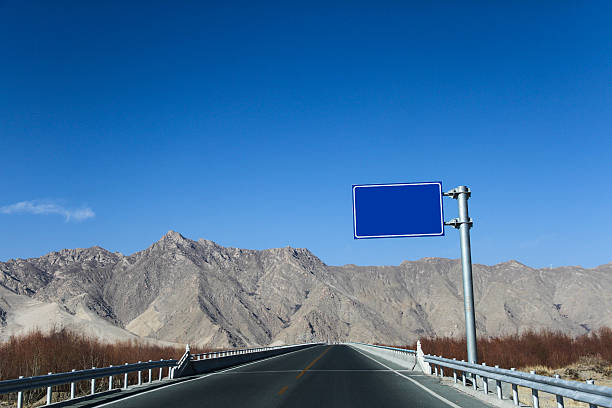Asphalted road and the blue sky in Tibet