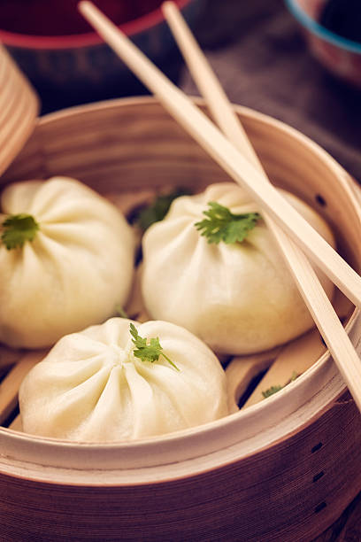 istock Dim Sum Dumplings Freshly Steamed in a Bamboo Steamer 504932940