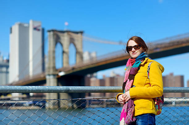 istock Young woman sightseeing by Brooklyn Bridge 504933440
