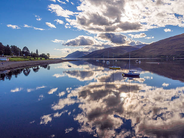 Evening reflections on Loch Linnhe, Fort William, Scotland, UK Evening reflections on Loch Linhe, Fort William, Scotland, UK fort william stock pictures, royalty-free photos & images