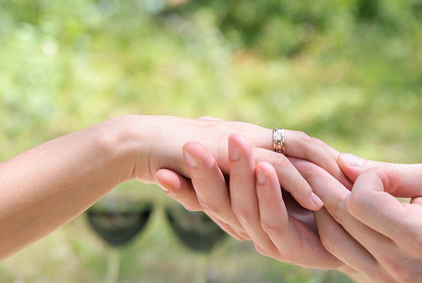 istock male and female hand 504983780