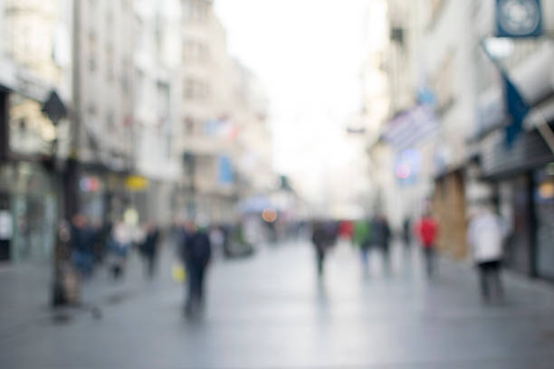 City commuters. High key blurred image of workers going back home after work. Unrecognizable faces, bleached effect.