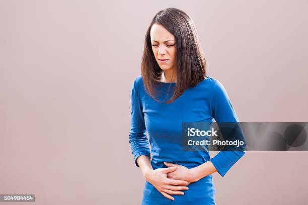 Pain In Stomach Stock Photo - Download Image Now - Adult, Beautiful People, Beauty