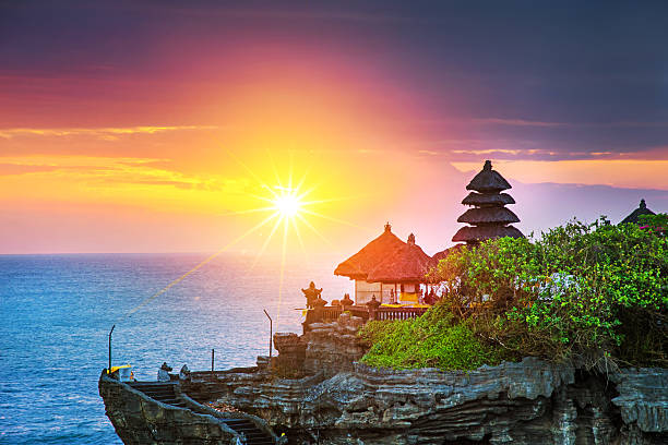 Bali Water Temple - Tanah Lot Beautiful Tanah Lot Hindu temple in Bali at sunset  tanah lot temple bali indonesia stock pictures, royalty-free photos & images