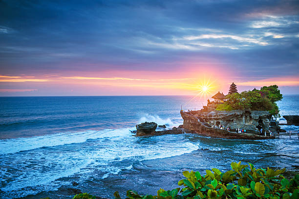 Bali Water Temple - Tanah Lot Beautiful Tanah Lot Hindu temple in Bali at sunset  balinese culture stock pictures, royalty-free photos & images