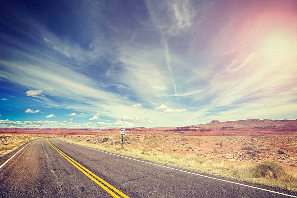 istock Vintage stylized endless country highway, USA. 504986308