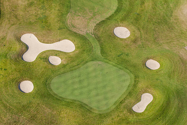 istock Aerial view over golf field bridge 504988326