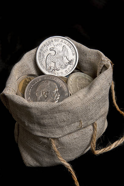istock USA silver dollar in bag 504988528