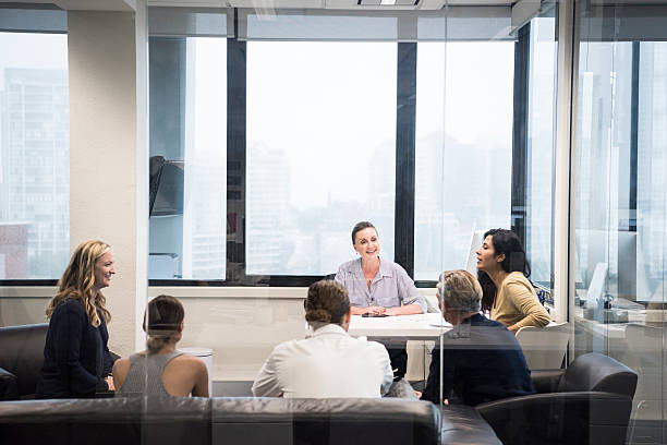 istock Business people on leather sofas meeting in modern office 504990102