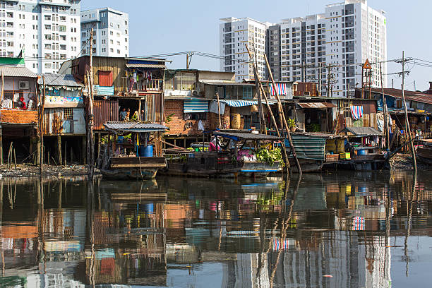 Ho Chi Minh, Vietnam - January 11, 2016: Floating market with reflection in water. Is located in the South of Vietnam, is the country's largest city, population 8 million.