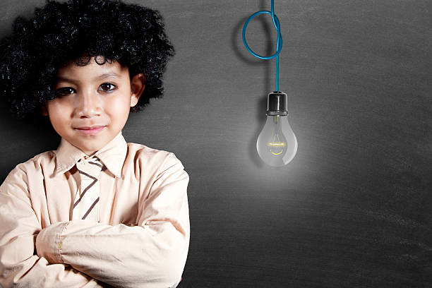 istock Portrait of a schoolboy with lightbulb 504996814
