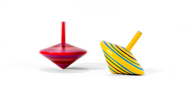 istock Two wooden and colorful spinning tops 504997190