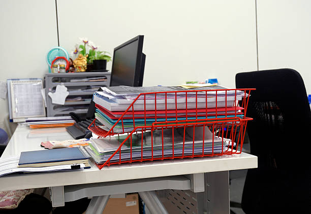 istock Red  basket of documents on the desk 504997358