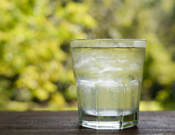 istock Glass water on green background.. 505015332