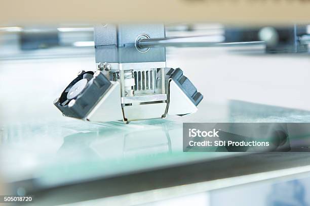 Head On 3d Printer Creating Object In Makerspace Closeup Stock Photo - Download Image Now