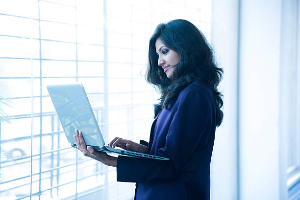 istock Businesswoman using touchscreen tablet in office 505019800