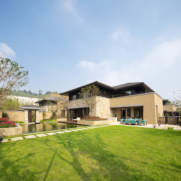 istock modern builing near meadow in blue sky 505020082