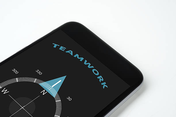Teamwork handy compass with text and arrow Teamwork handy compass with text and arrow. compass gear efficiency teamwork stock pictures, royalty-free photos & images