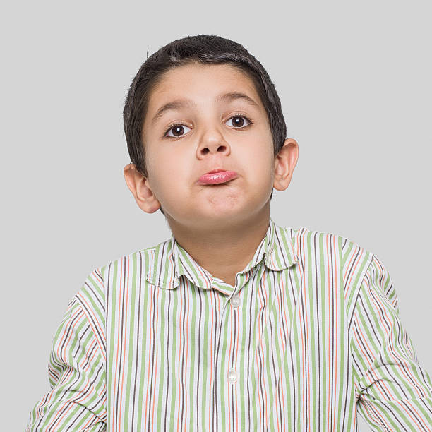 istock Little boy shrugging shoulders 505024296
