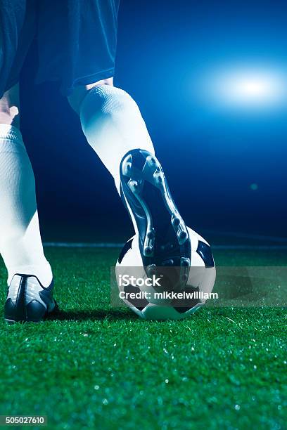 Soccer Player Runs To Ball And Kicks It Stock Photo - Download Image Now - Soccer, Soccer Ball, Stadium