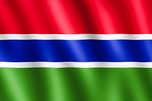 Flag of Gambia waving in the wind giving an undulating texture of folds in the fabric. The Image is in the official ratio of the flag - 2:3.