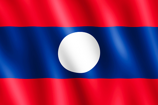 Flag of Laos waving in the wind giving an undulating texture of folds in the fabric. The Image is in the official ratio of the flag - 2:3.