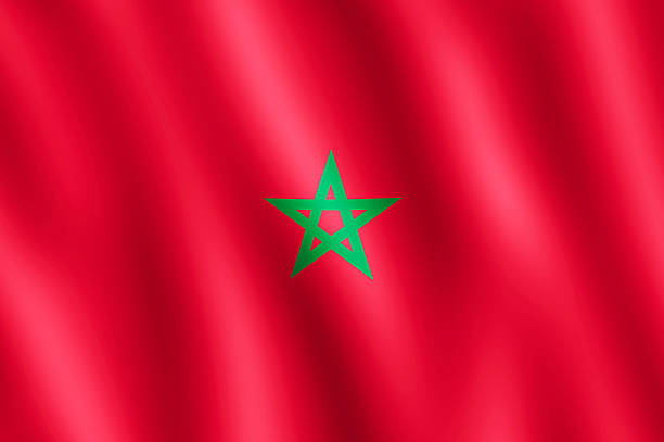 Flag of Morocco waving in the wind giving an undulating texture of folds in the fabric. The Image is in the official ratio of the flag - 2:3.
