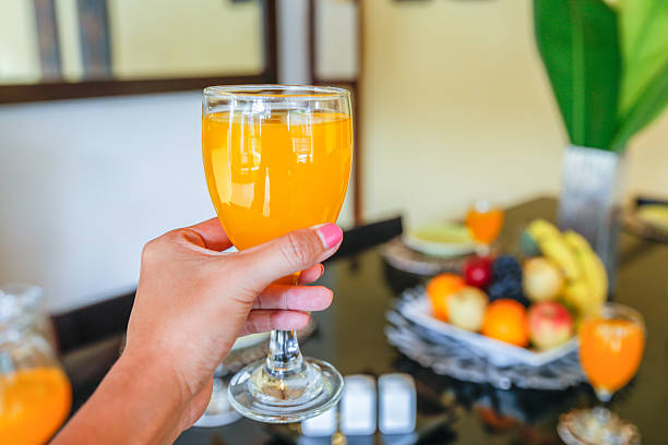 istock Young women toasting orange juice 505030920