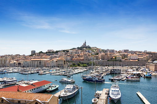 Panoramic view on old port and basilica of Notre Dame de la Garde in Marseille, France